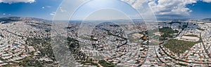 Aerial panoramic drone shot of Athens Pangari district with Acropolis, Olympion Zeus temple, Zappeion hall