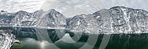 Aerial panoramic drone shot of Hallstatt village by lake surroun