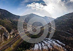 Aerial panoramic drone view of a scenic highway by the beautiful Landscape covered in clouds and fog, bridge and viaduct