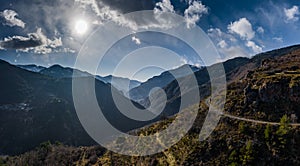 Aerial panoramic drone view of a scenic highway by the beautiful Landscape covered in clouds and fog, bridge and viaduct