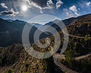 Aerial panoramic drone view of a scenic highway by the beautiful Landscape covered in clouds and fog, bridge and viaduct