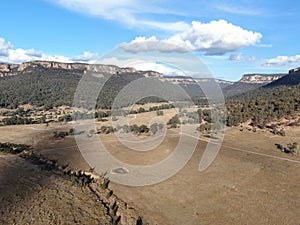 Aerial panoramic drone view of Wolgan Valley along the Wolgan River in the Lithgow Region of New South Wales, Australia.