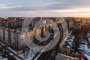 Aerial panoramic evening cityscape from rooftop of Voronezh. Houses, sunset, sky