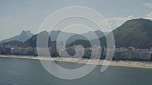 Aerial, panoramic footage of The City of Rio de Janeiro and Copacabana beach