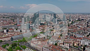 Aerial panoramic footage of modern urban borough with high rise office buildings towering above surrounding town