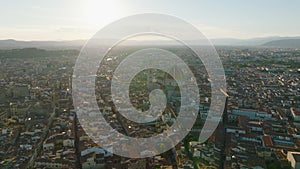 Aerial panoramic footage of most known city sights against setting sun. Majestic cupola of Duomo di Firenze. Florence