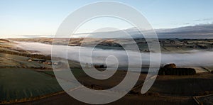 Aerial panoramic landscape of a cloud inversion at Haydon Bridge in the River Tyne Valley