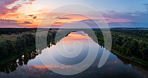 Aerial panoramic landscape with sunset over the river and beautiful clouds on the sky