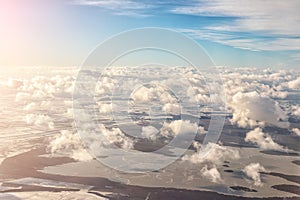 Aerial panoramic landscape view of earth with frozen lake and field. Cloudscape skyline photo from plane landing in austrian