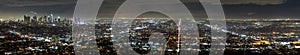 Aerial panoramic night view of Los Angeles metropolitan area; Financial District and the downtown area visible on the left