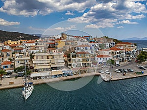 Aerial panoramic photo of picturesque seaside town of Ermioni built in peninsula with forest of Bistis at the end, Argolida,