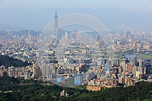 Aerial panoramic scene of overpopulated Taipei City in a hazy morning with a view of Taipei 101 tower in XinYi District photo