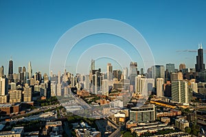 Aerial, panoramic shot of a Chicago skyline during summer sunset