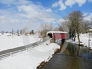 An Aerial shot of Erb\'s Mill Covered Bridge on a winter day in Lancaster Pennsylvania photo