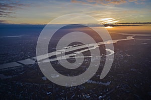 Aerial Panoramic skyline view at golden hour sunset during cloudy skies