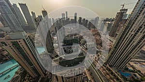 Aerial panoramic sunrise over big futuristic city all day timelapse. Business bay and Downtown