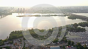 Aerial panoramic view of automobile and railroad Darnitsky bridge across Dnieper river.