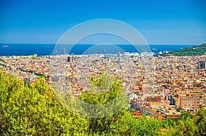 Aerial panoramic view of Barcelona city historical quarters districts with Mediterranean Sea