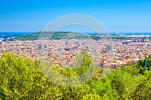 Aerial panoramic view of Barcelona city historical quarters districts with Montju c hill, Mediterranean Sea