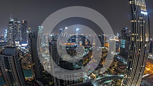 Aerial panoramic view of a big futuristic city all night timelapse. Business bay and Downtown