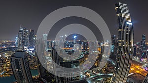 Aerial panoramic view of a big futuristic city all night timelapse. Business bay and Downtown