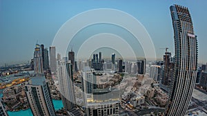 Aerial panoramic view of a big futuristic city day to night timelapse. Business bay and Downtown