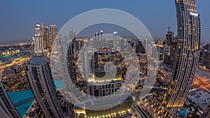 Aerial panoramic view of a big futuristic city day to night timelapse. Business bay and Downtown