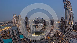 Aerial panoramic view of a big futuristic city day to night timelapse. Business bay and Downtown