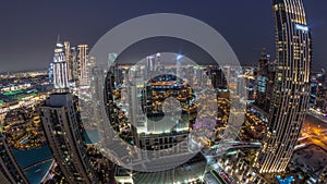 Aerial panoramic view of a big futuristic city day to night timelapse. Business bay and Downtown