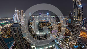 Aerial panoramic view of a big futuristic city day to night timelapse. Business bay and Downtown
