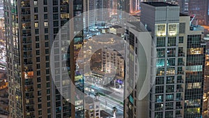 Aerial panoramic view of a big futuristic city night timelapse. Business bay and Downtown