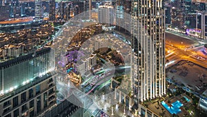 Aerial panoramic view of a big futuristic city night timelapse. Business bay and Downtown