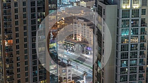 Aerial panoramic view of a big futuristic city night timelapse. Business bay and Downtown