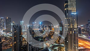 Aerial panoramic view of a big futuristic city night timelapse. Business bay and Downtown