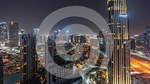 Aerial panoramic view of a big futuristic city night timelapse. Business bay and Downtown