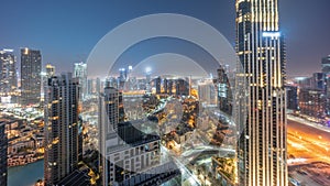 Aerial panoramic view of a big futuristic city night to day timelapse. Business bay and Downtown