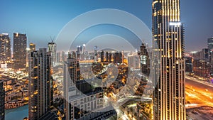 Aerial panoramic view of a big futuristic city night to day timelapse. Business bay and Downtown