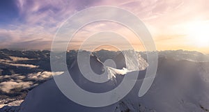 Aerial Panoramic View of Canadian Mountain covered in snow