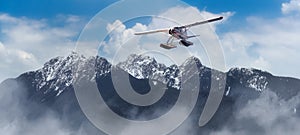 Aerial Panoramic View of Canadian Rocky Mountain Landscape with Seaplane Flying