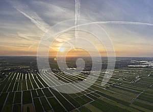 Aerial panoramic view of cultivated reclaimed land in the Netherlands at sunset