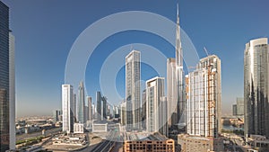 Aerial panoramic view of Dubai Downtown skyline with many towers timelapse.