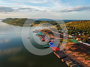 Aerial panoramic view of fishing village on the lake with mountain, Clouds and blue sky background