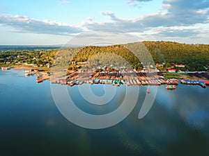 Aerial panoramic view of fishing village on the lake with mountain  Clouds and blue sky background