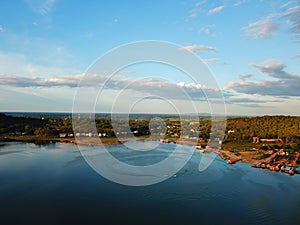 Aerial panoramic view of fishing village on the lake with mountain  Clouds and blue sky background