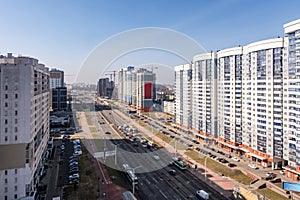 aerial panoramic view from great height of city with a private sector and high-rise urban apartment skyscraper buildings