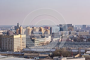 aerial panoramic view from great height of city with a private sector and high-rise urban apartment skyscraper buildings