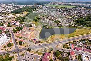 aerial panoramic view from great height of provincial town with a private sector and high-rise urban apartment buildings