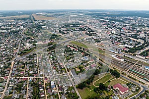 aerial panoramic view from great height of provincial town with a private sector and high-rise urban apartment buildings