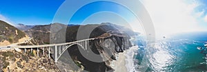 Aerial panoramic view of historic Bixby Creek Bridge along world famous Pacific Coast Highway 1 in summer sunny day , Monterey