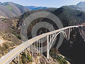 Aerial panoramic view of historic Bixby Creek Bridge along world famous Pacific Coast Highway 1 in summer sunny day , Monterey